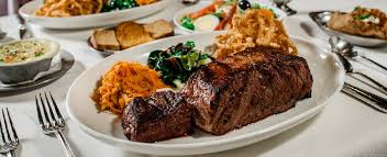 Bern's Steak House signature dishes  Dry-Aged Steaks (various cuts like Delmonico, Chateaubriand), French Onion Soup, Macadamia Nut Sundae (in the dessert room), Steak Tartare.
